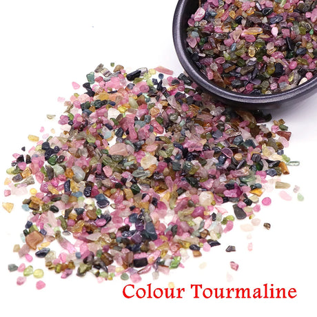 Colored Tourmaline stones with a bowl of stones.