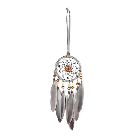 Dreamcatcher with feathers and beads on a white background