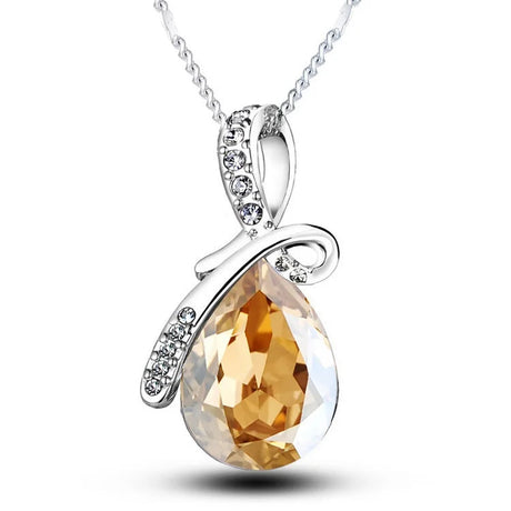 Gold teardrop pendant necklace with silver chain on a white background, featuring the brand 'Giemi'.