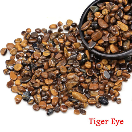 Tiger eye stones with a bowl on a white background