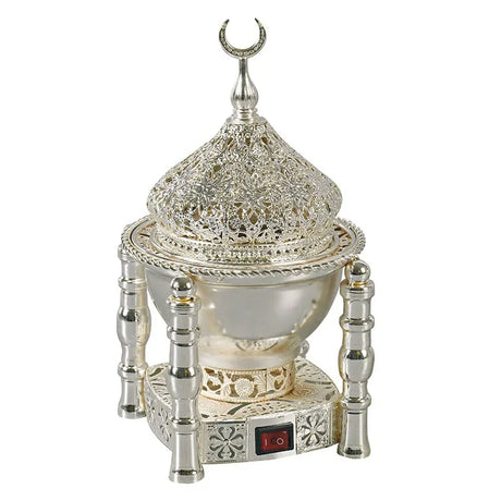 Decorative silver lamp with intricate design on a white background