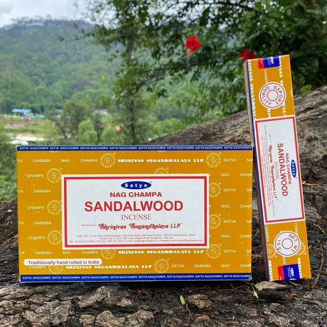 Satya Nag Champa Sandalwood incense packaging on a natural background