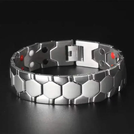 Metallic bracelet with a geometric design on a black background