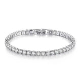 Silver bracelet with clear stones on a white background