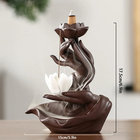 Decorative incense burner shaped like hands holding lotus flowers with measurements on a neutral background