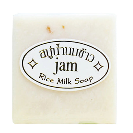 Bar of rice milk soap with a label on a white background