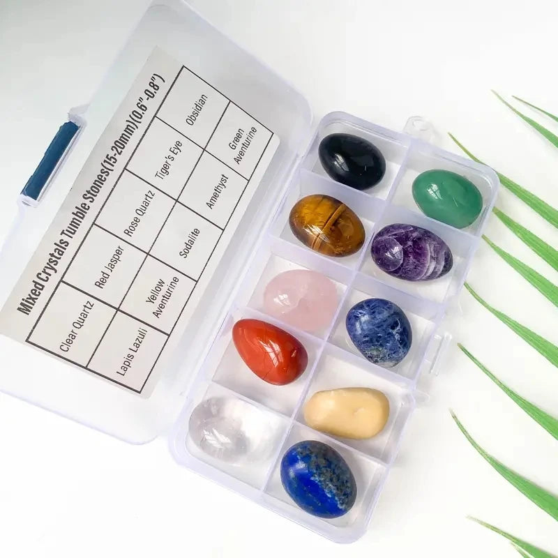 Set of colorful crystals in a white case with labels on a white background
