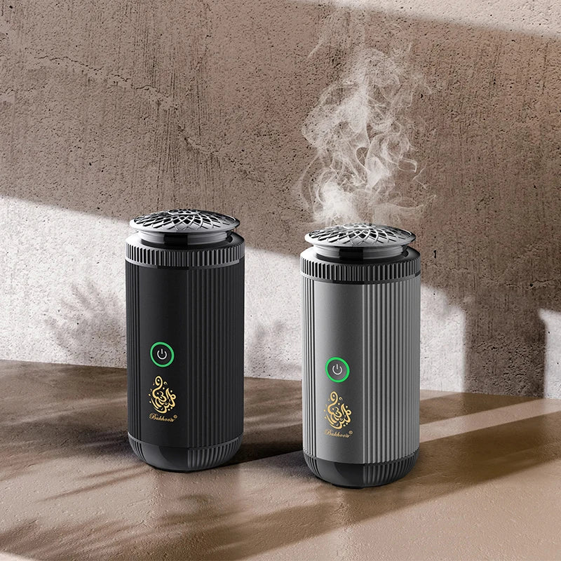 Two black and gray electronic devices emitting steam on a wooden surface with a concrete wall background.