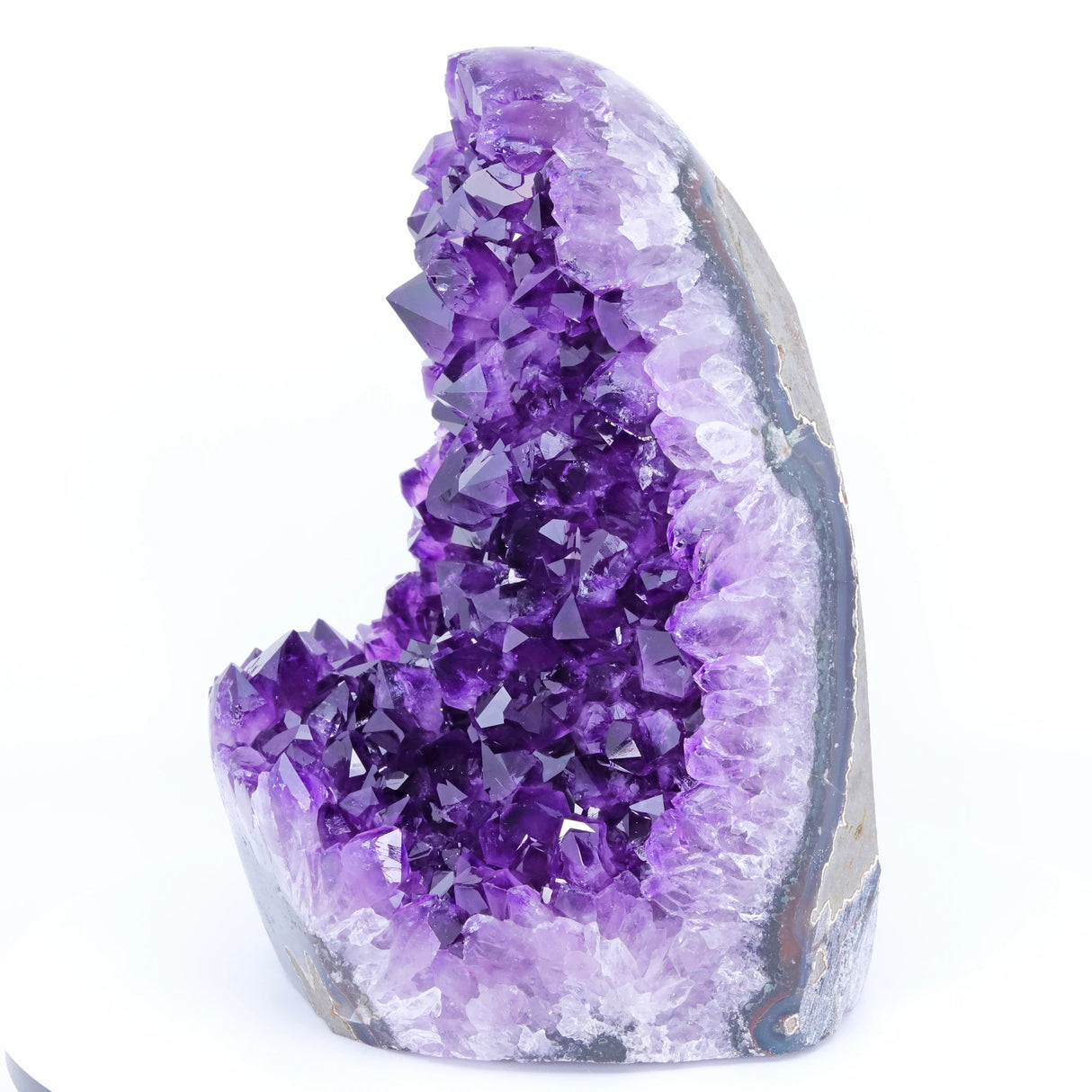 Amethyst crystal formation on a white background