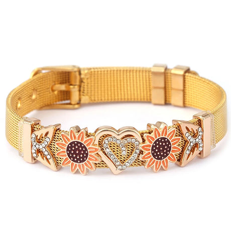 Gold mesh bracelet with sunflower and heart designs on a white background