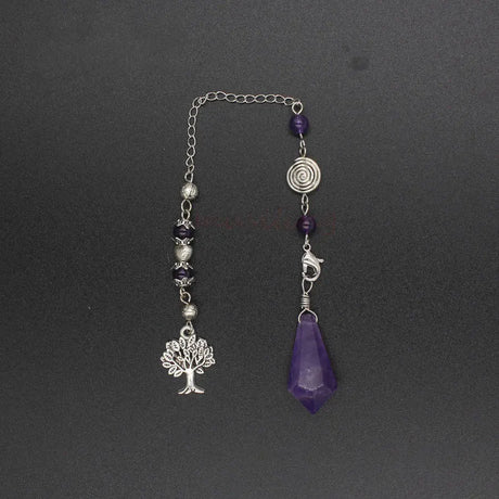 Decorative keychain with tree of life charm, purple crystal, and beads on a dark background