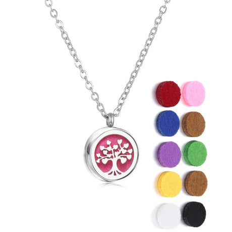 Necklace with a tree of life pendant and colorful felt pads on a white background