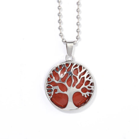 Silver necklace with a red tree of life pendant on a white background