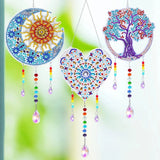 Decorative wall hangings with colorful patterns and beads on a blurred green background