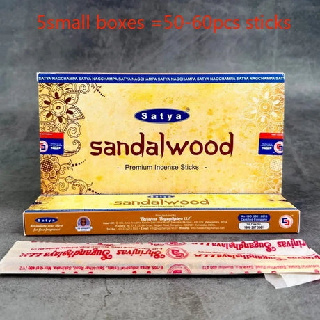 Satya sandalwood incense packaging on a gray background