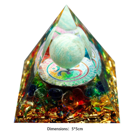 Crystal pyramid with a spherical object inside on a white background