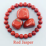 Red Jasper stones arranged in a circle on a white background with 'Red Jasper' text.