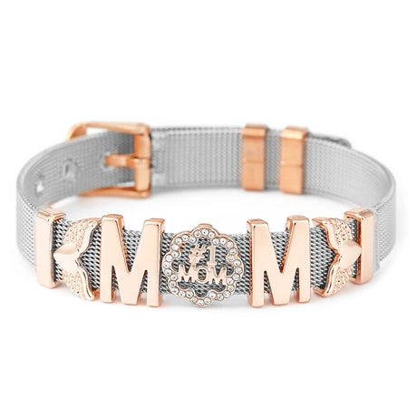 Gray dog collar with rose gold hardware and decorative elements on a white background