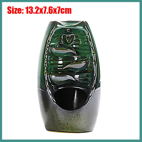 Green ceramic vase with textured design on a white background