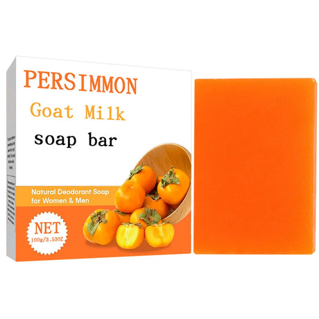 Persimmon goat milk soap bar packaging with an orange soap bar on a white background