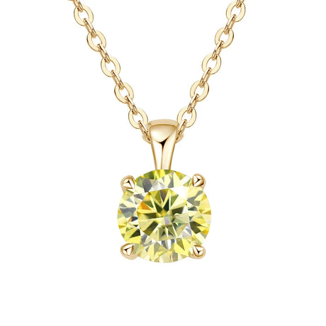 Gold necklace with a yellow gemstone pendant on a white background