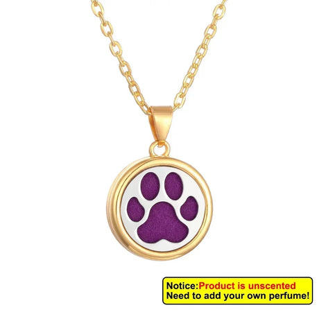 Gold necklace with a purple paw print pendant on a white background