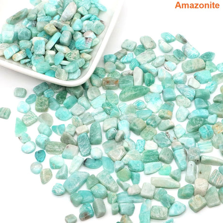 Amazonite stones with a white scoop on a white background