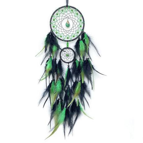 Green and black dreamcatcher with feathers on a white background