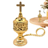 Gold censer with cross on top on a white background