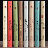 Set of incense sticks in various colored tubes with text and designs on a dark background