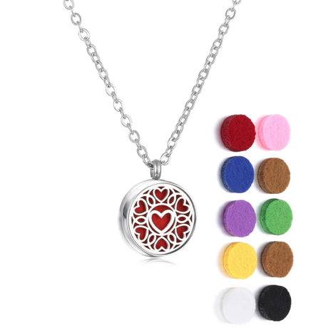 Necklace with a heart-shaped pendant and colorful felt pads on a white background