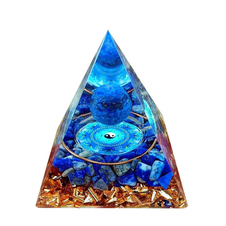 Pyramid-shaped crystal with blue lights and stones on a white background