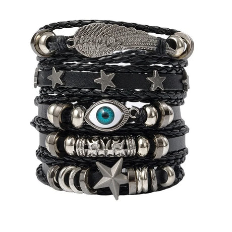 Stack of black leather bracelets with metal charms on a white background