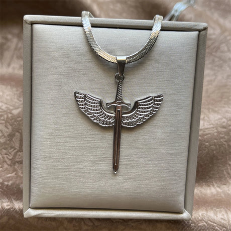 Silver pendant with wings on a necklace in a box