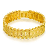 Gold bracelet with intricate design on a white background