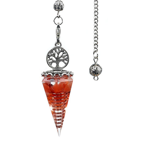 Crystal pendulum with tree of life design on a white background