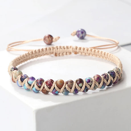 Beaded bracelet with multicolored beads on a white surface