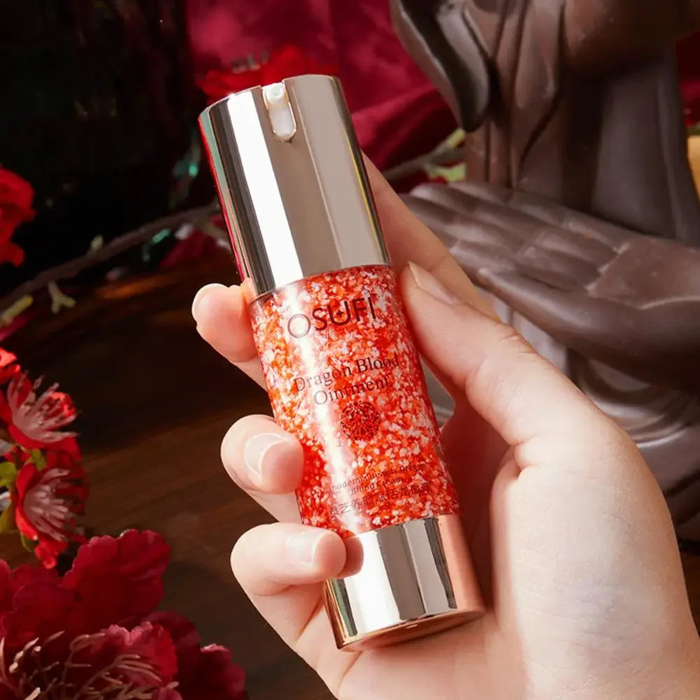 Hand holding a glittery makeup product with a blurred background