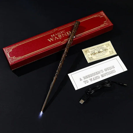 Magic wand with USB cable, instruction sheet, and red box on a dark background