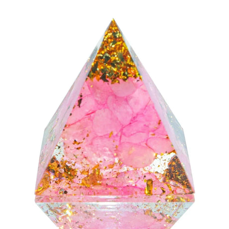 Triangular resin pendant with pink and gold glitter on a white background