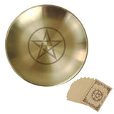 Brass dish with pentagram design and matching cards on a white background