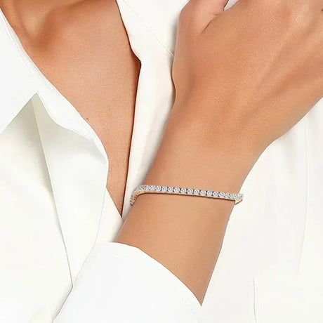 Close-up of a hand wearing a diamond bracelet on a white background