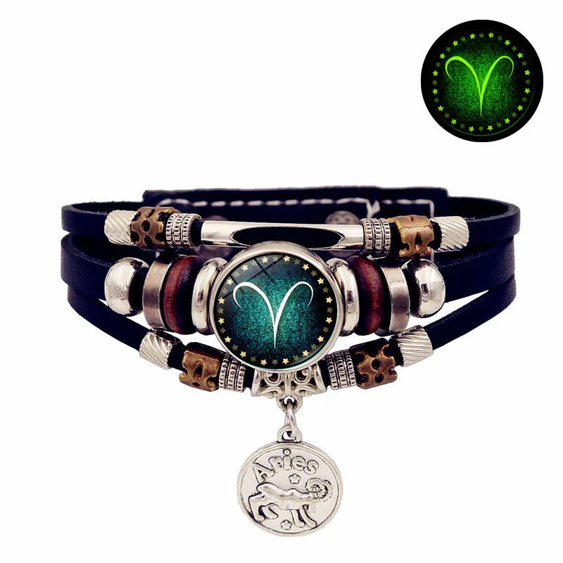 Multistrand bracelet with zodiac charm on a white background
