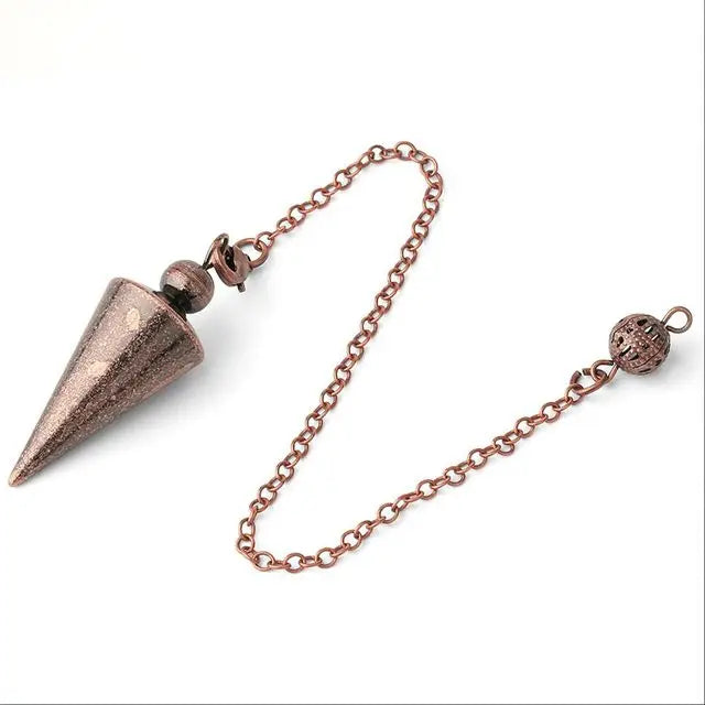 Metallic pendulum on a chain against a white background