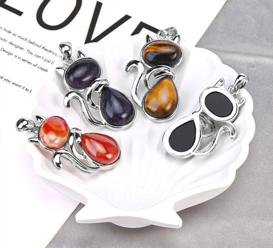 Set of colorful stone pendants on a white stand with 'LOVE' text in the background.