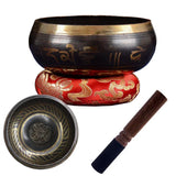 Tibetan singing bowl set with a bowl, cushion, and striker on a white background