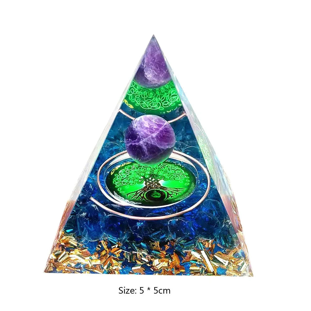 Pyramid-shaped crystal with purple and green balls inside on a white background