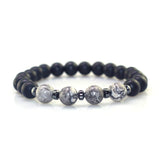 Black and gray beaded bracelet on a white background