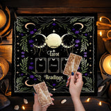 Tarot card reading setup with tarot cards and a decorative sign in a cozy, candlelit setting.