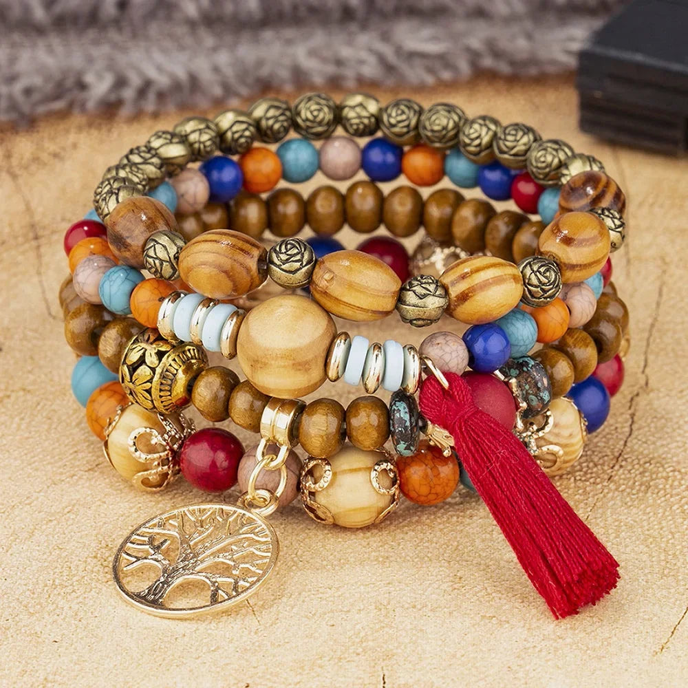 Multicolored beaded bracelet with tassel on a textured surface